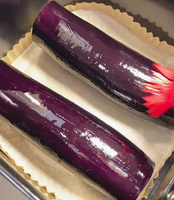 brush the surface of eggplants with oil
