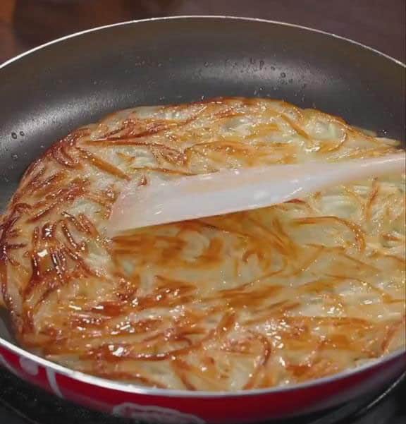 flip the pancake over using a spatula